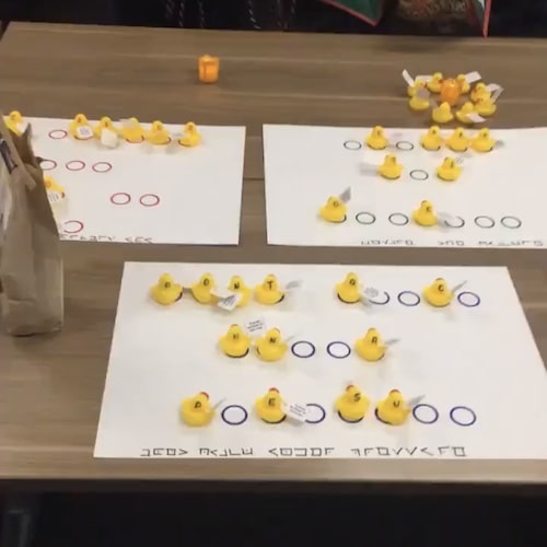 Rubber ducks on paper placemats